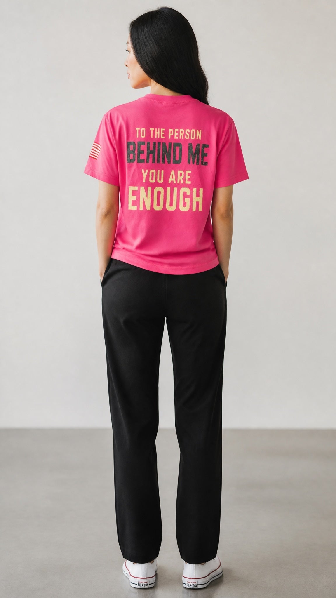 Forged By God bright pink crewneck t-shirt with inspirational back print and American flag sleeve detail on a model