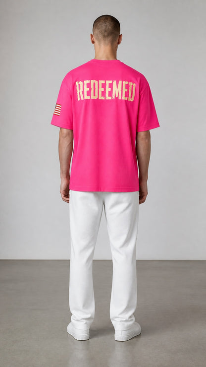 Forged By God hot pink short sleeve t-shirt with distressed REDEEMED back print and American flag sleeve detail